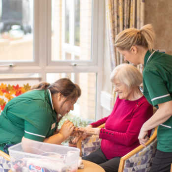 resident and carers at Sycamore Park care home in Huddersfield, Kirklees