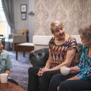 resident and carers at Sycamore Park care home in Huddersfield, Kirklees