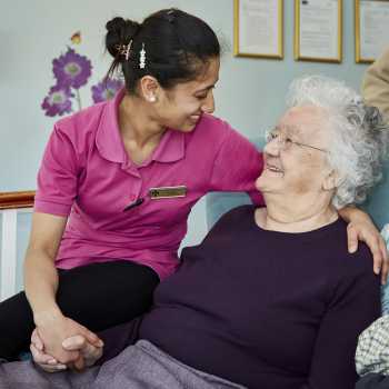 Resident and carer smiling