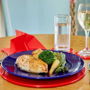 Roasted Chicken and vegetable with glass of white wine for residents